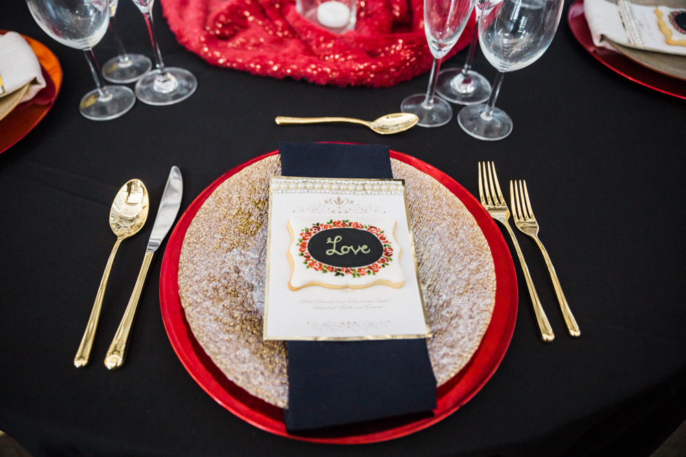 black red and gold wedding details