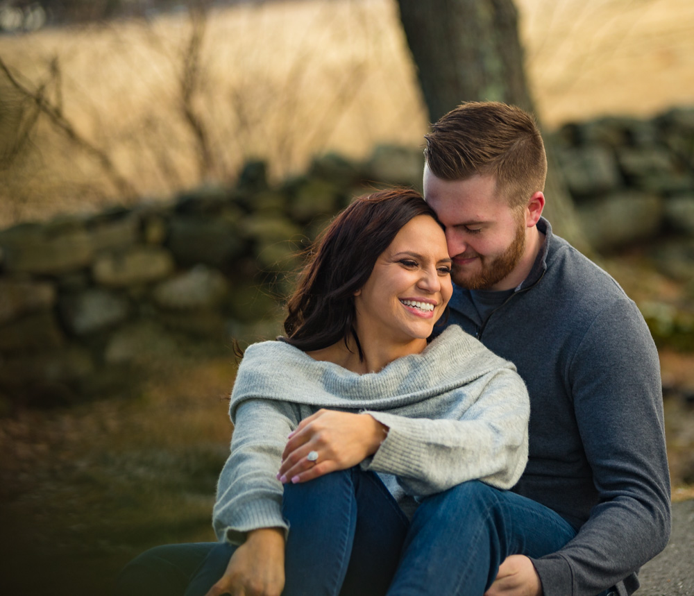couple sitting at topsmead engagement session