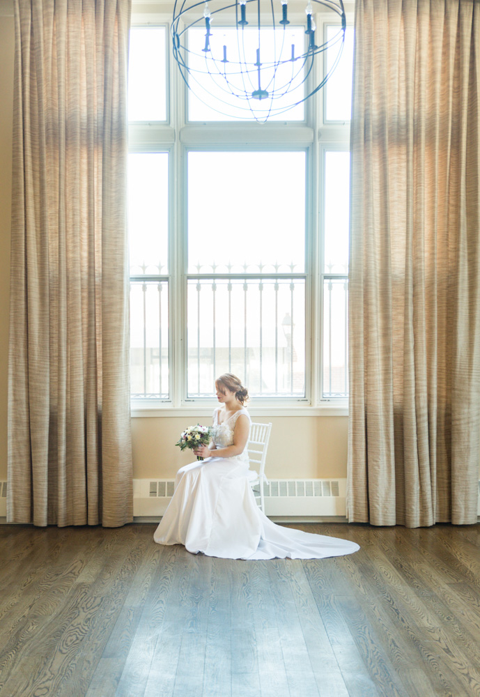 Bride sitting in chair at 19 Main