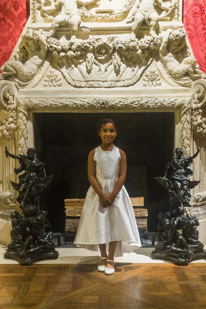 GIrl in front of fireplace at the Met