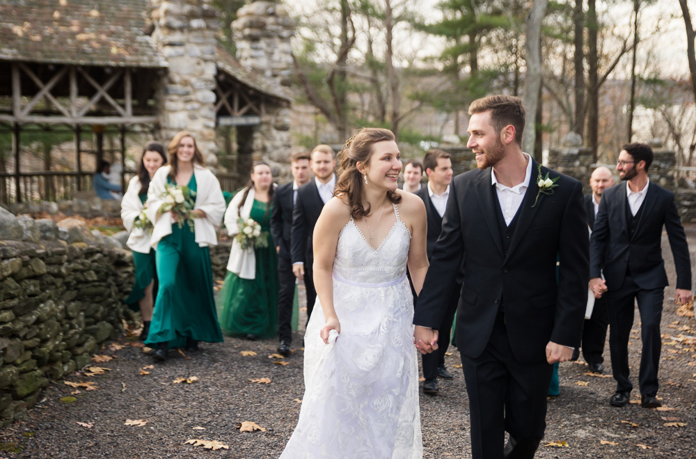 couple walking with bridal party at Gillette Castle  
