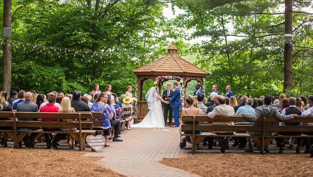 wedding ceremony at the pavilion on crystal lake taking by a Connecticut wedding photographer Raina McMillan