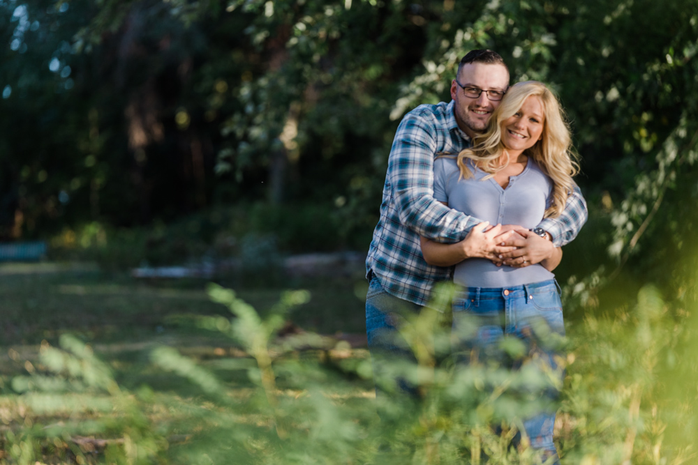 couple hugging at a wethersfield cove engagement session