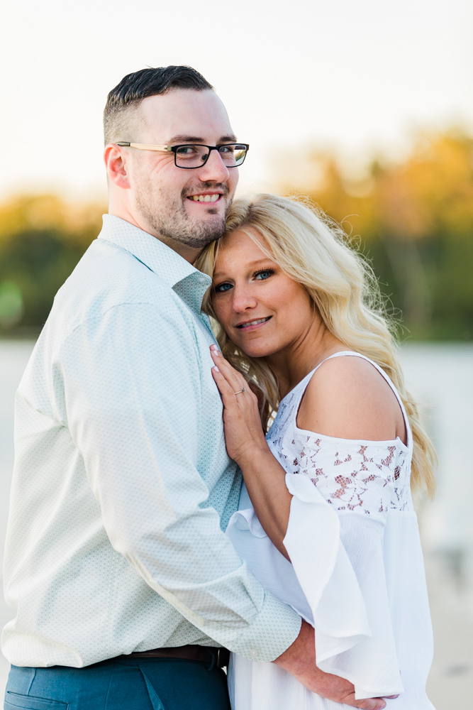 couple by the water at wethersfield cove engagement session