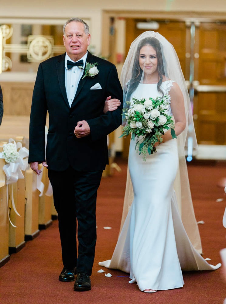 bride walking with her father at her hillstead museum backyard wedding 