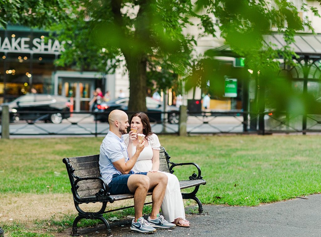 couple eating ice cream during their yale maternity session