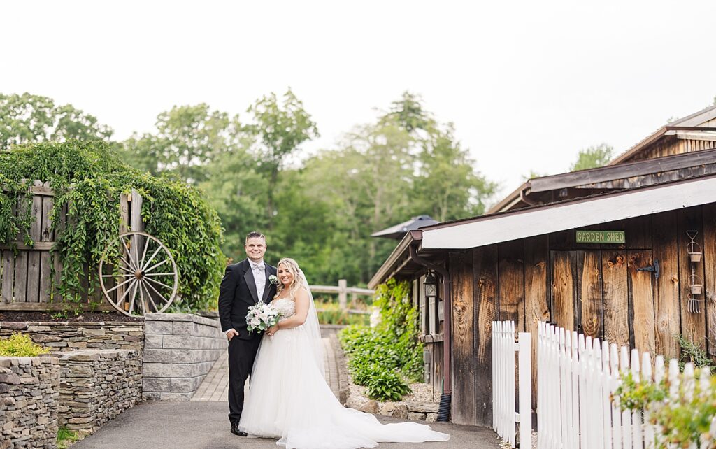 a bride and groom at their wood acres farm wedding